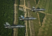 A Navy F-35C, a Marine Corps F-35B, and an Air Force F-35A Lightning II participate in a training sortie together May 21, 2014, near Eglin Air Force Base, FL