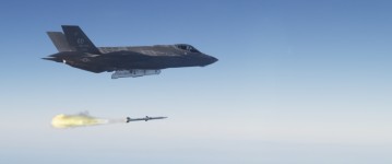 An F-35 Lightning II launches an AIM-120 advanced medium range air-to-air missile (AMRAAM) over a military test range off the California coast