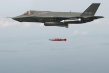 F-35B test aircraft BF-3 dropping an inert 1,000-pound GBU-32 Joint Direct Attack Munition over an Atlantic Ocean test range from an internal weapons bay
