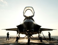 The flight deck crew secures an F-35B Lighting II aircraft aboard the amphibious assault ship USS Wasp (LHD 1) following testing